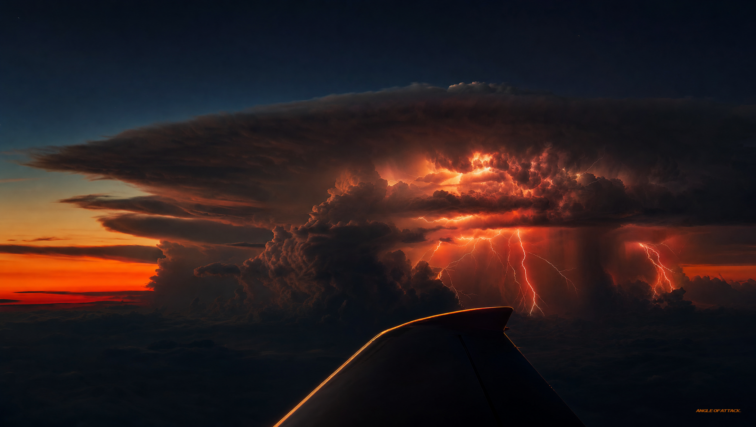 A cumulonimbus cloud with a classic spreading anvil top seen from a safe distance off the wingtip